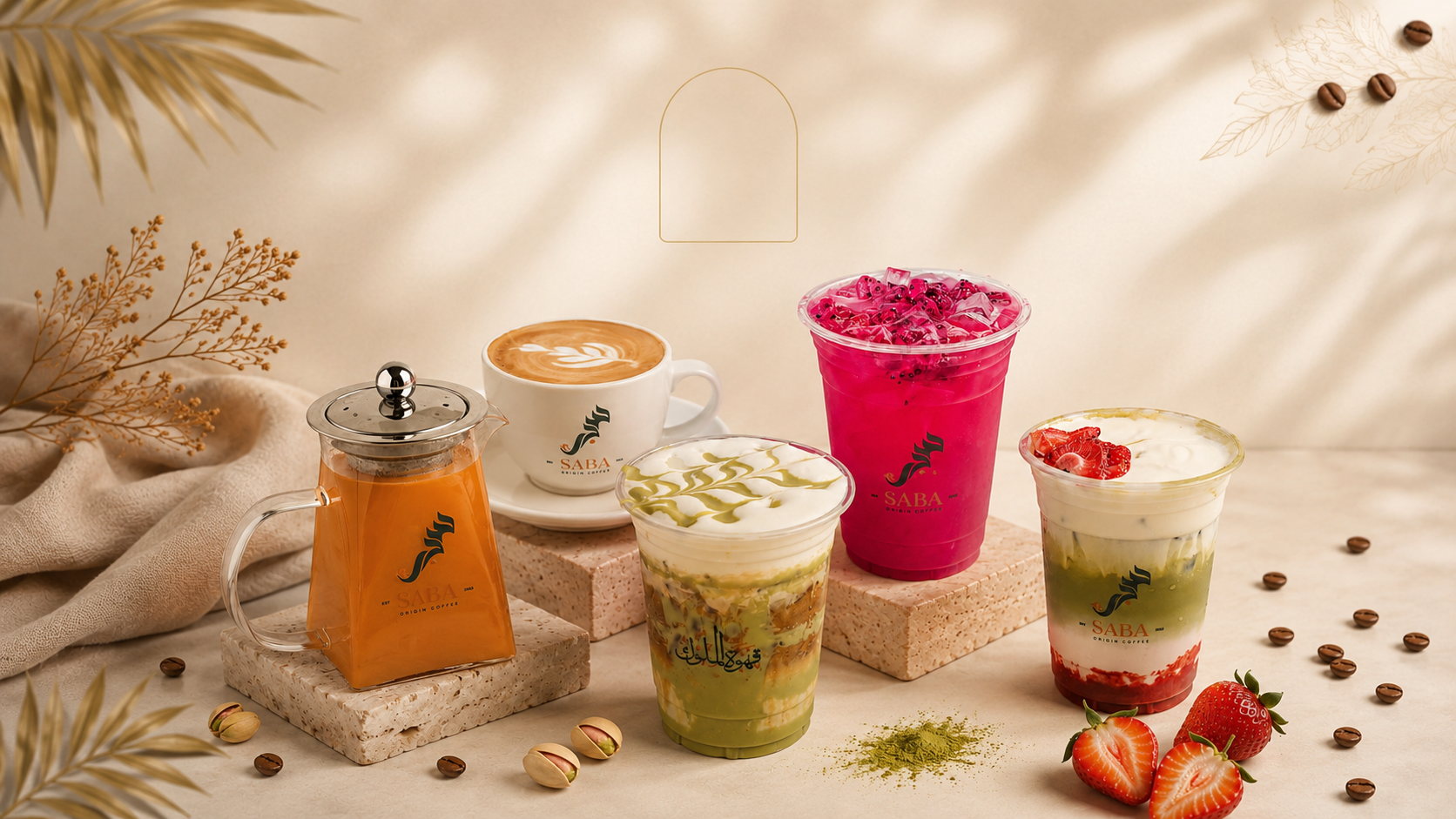 Saba Origin Coffee signature drinks — Adeni chai, pistachio matcha, dragonfruit refresher and strawberry matcha styled with coffee beans, pistachios and fresh strawberries