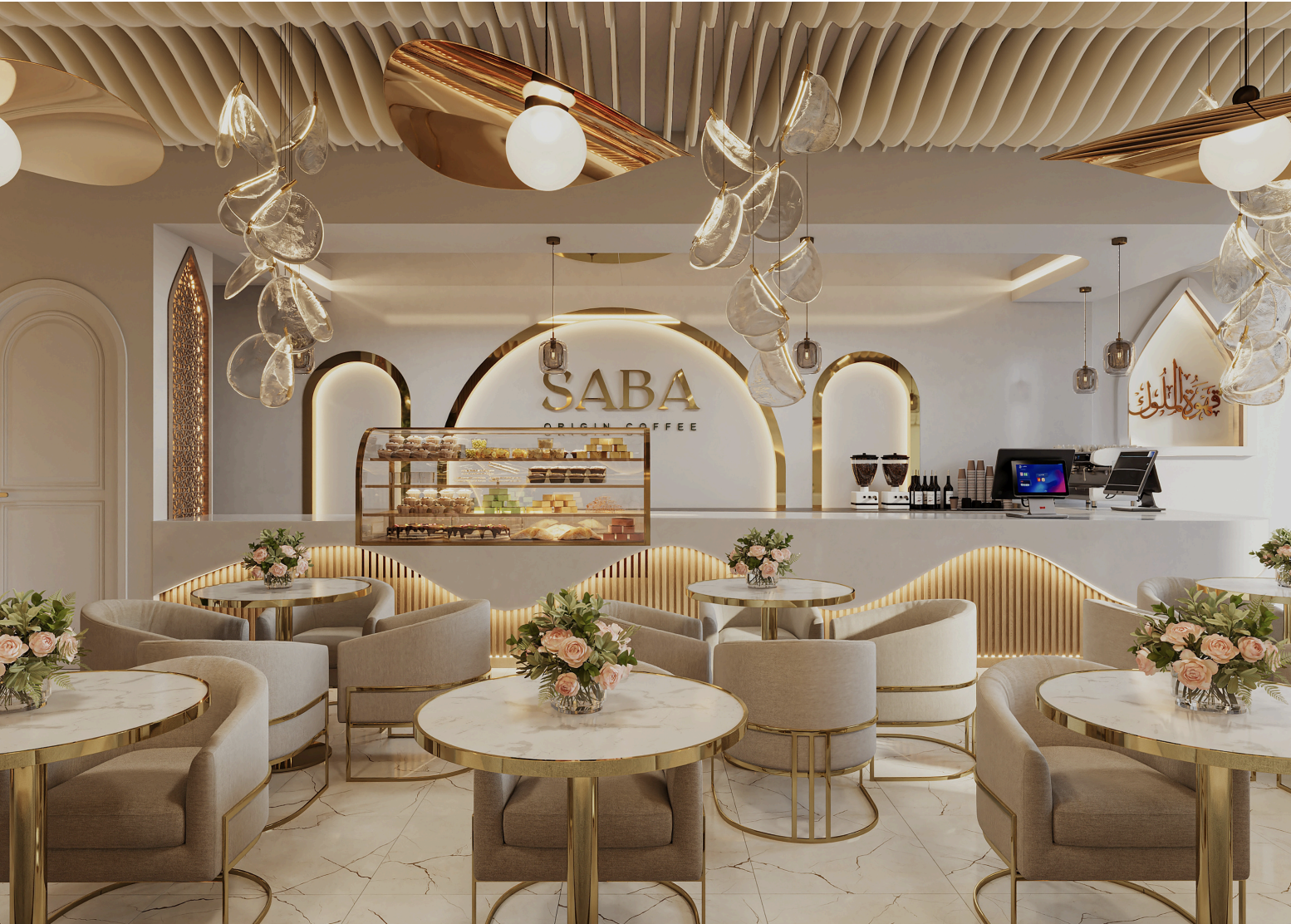 The Saba Origin Coffee counter with its gold sign, pastry display case, and marble tables set with roses